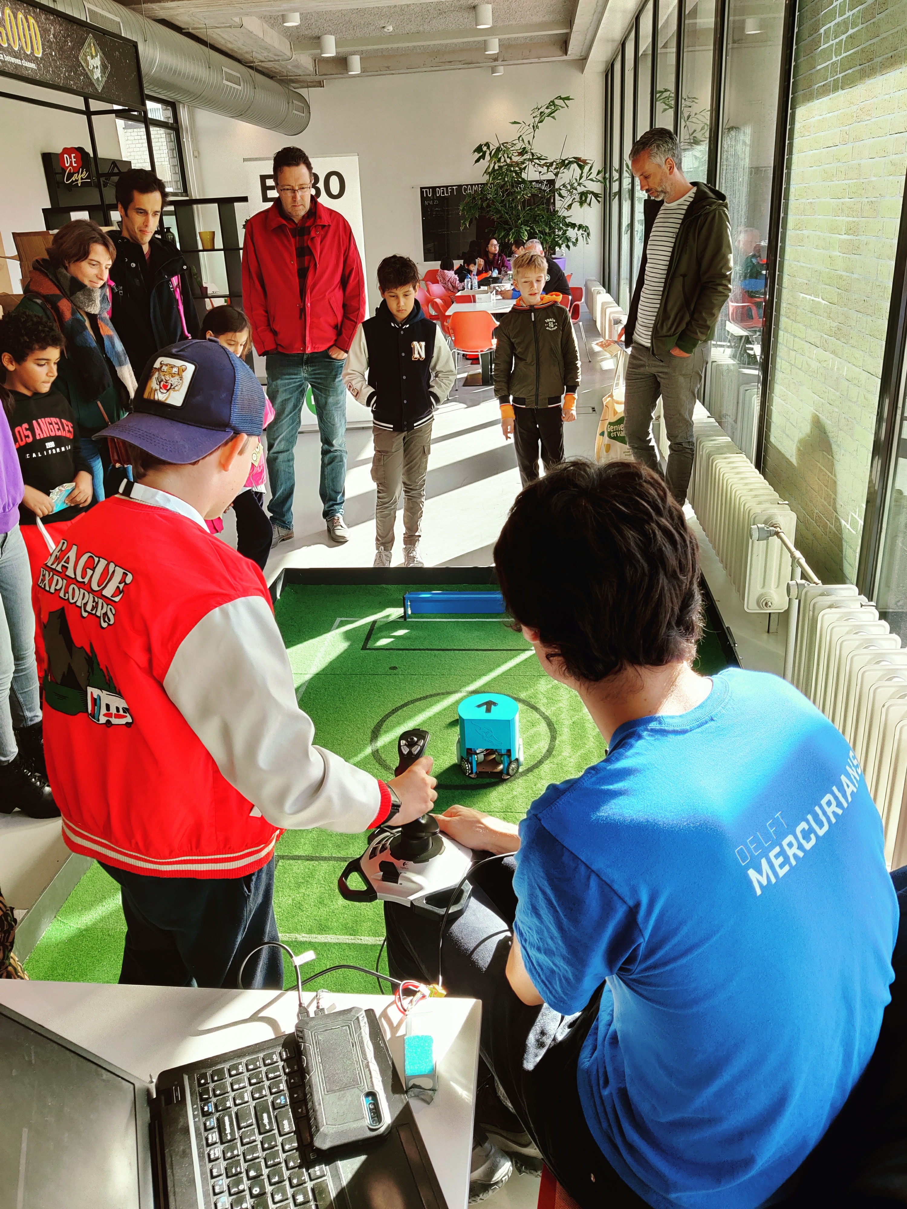 Picture of Thomas instructing the visitors to drive the robot